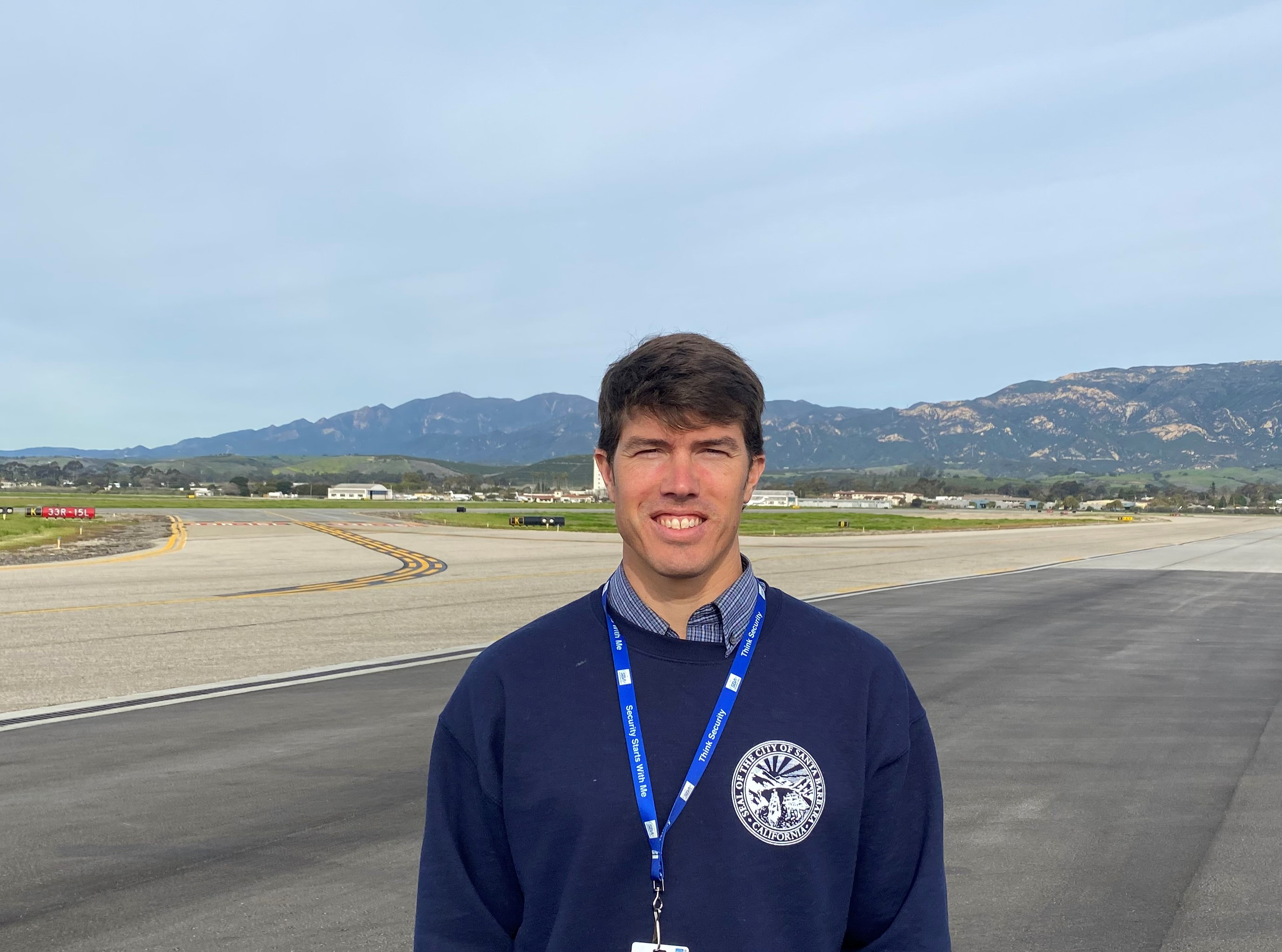 Employee of the Month Brad Klinzing standing on the airfield