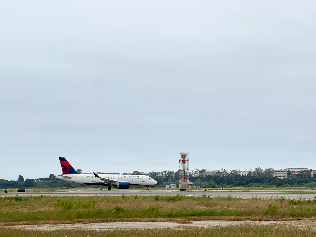 Wide shot of a Delta plane on the taxiway