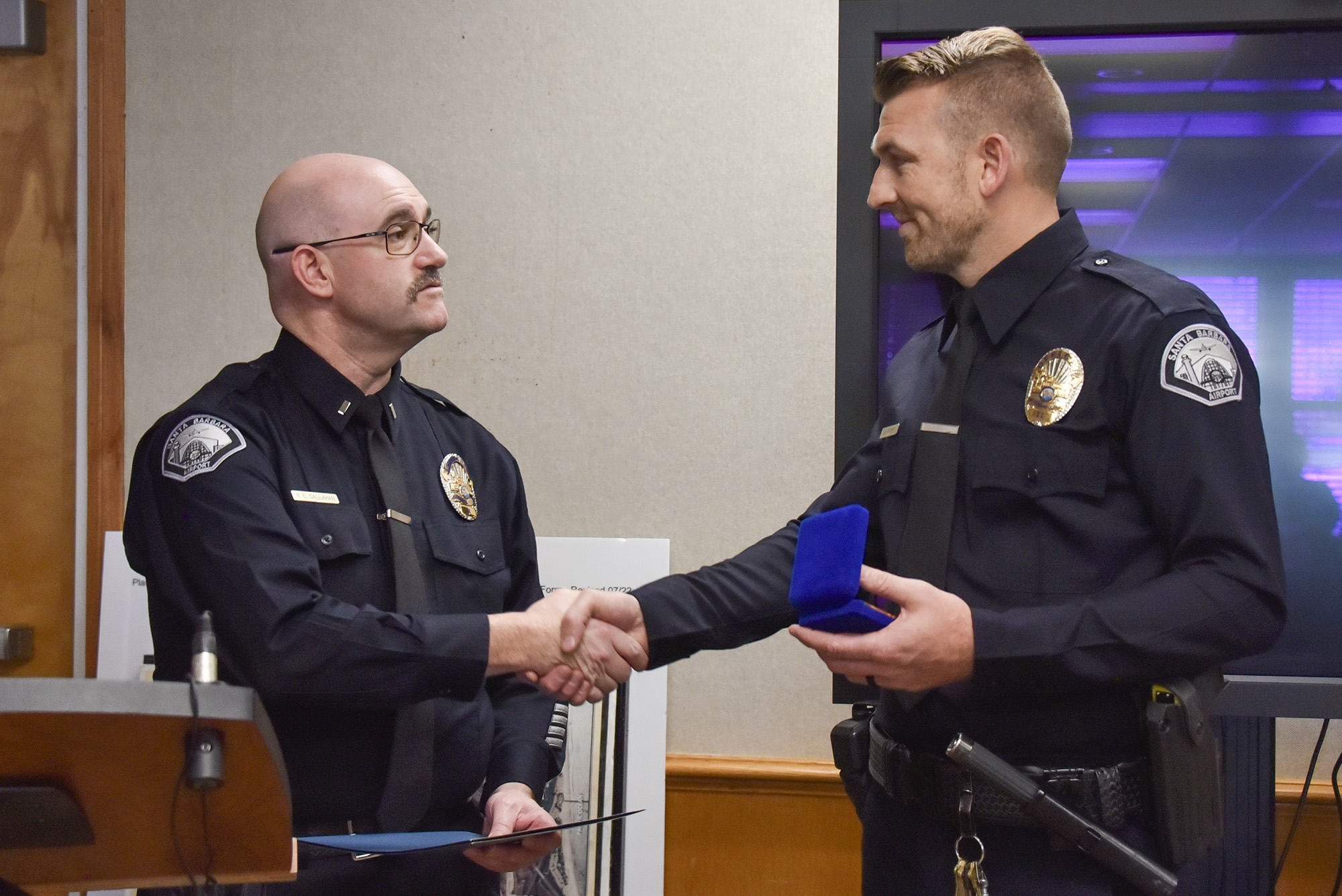 Officer Knight receives Life-Saving Award from SBA staff.