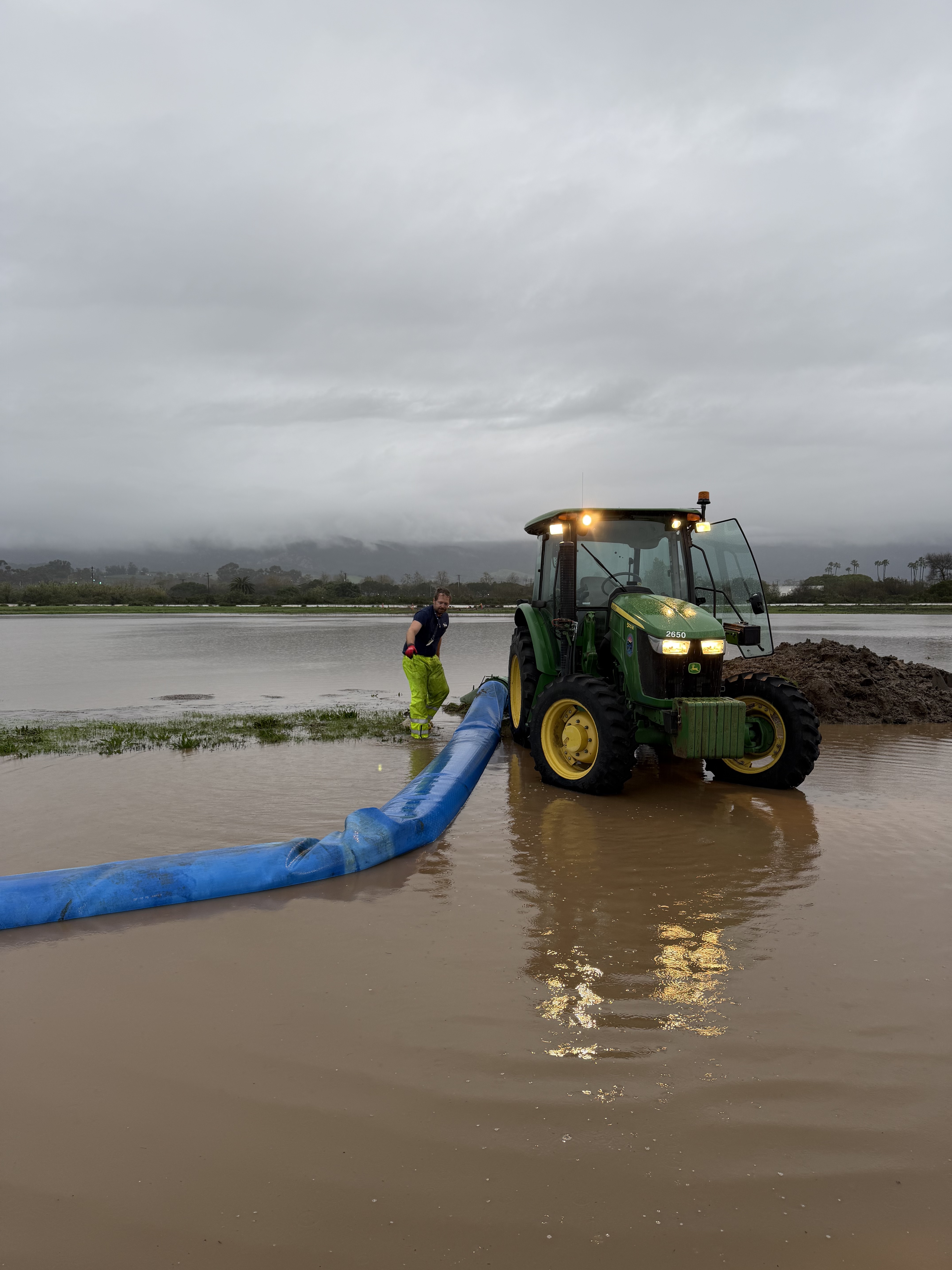 crews working on flooded airfield