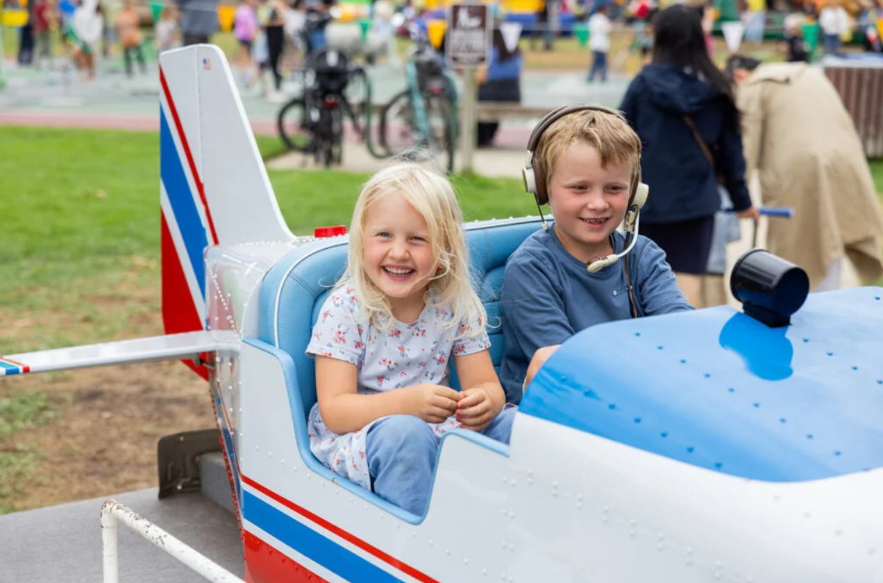 Children in kids zone at lemon festival