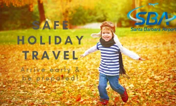 Safe Holiday Travel Tips with young boy running through fall leaves