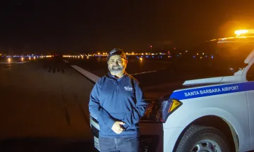 SBA Staff Ryan on airfield at nigh