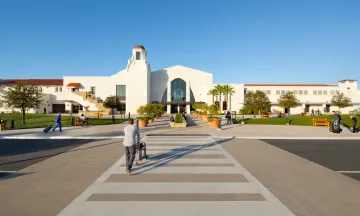 Passengers walking in the Santa Barbara Airport Terminal on a bring sunny day