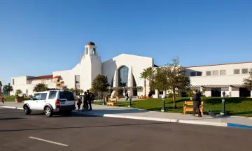 Entrance of Santa Barbara Airport with a car parked