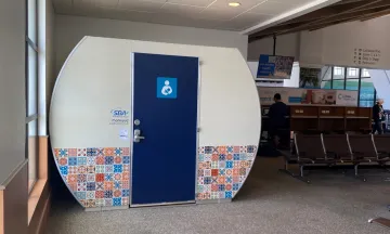New Mamava Lactation Pod at the Airport, showcasing Spanish tile artwork on the outside of the freestanding dome-like structure
