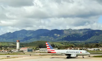 Wide shot of the SBA airfield and an American Airlines plane