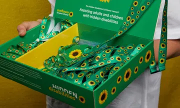 Box filled with green Sunflower Program lanyards