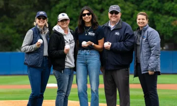 SBA staff pose with UCSB staff on a baseball field