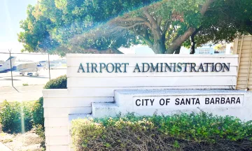 Sign reads Airport Administration, City of Santa Barbara with planes in the background