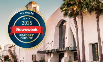 Front entrance of the SBA terminal with graphic that reads "2025 newsweek readers choice nominee"