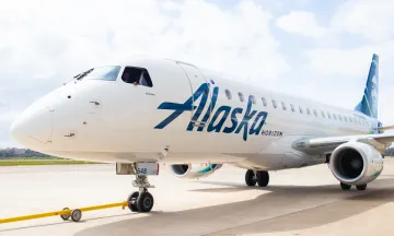 An Alaska Airlines plane sits on the SBA tarmac