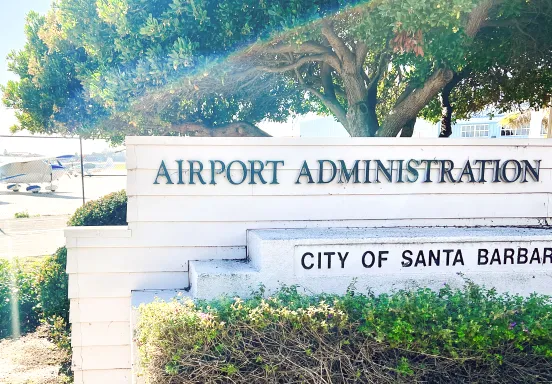 Sign reads Airport Administration, City of Santa Barbara with planes in the background