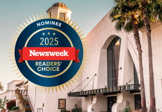 Front entrance of the SBA terminal with graphic that reads "2025 newsweek readers choice nominee"