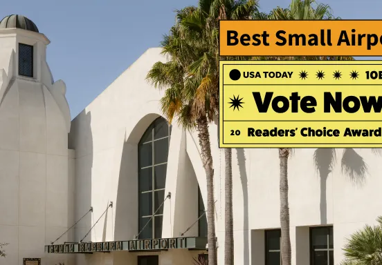 Front entrance of the terminal with text that says vote now best small airport