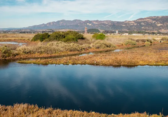 The goleta slough filled with water and the airport in the background