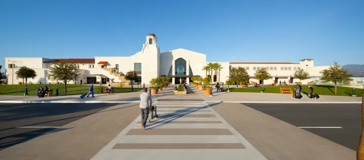 Passengers walking in the Santa Barbara Airport Terminal on a bring sunny day