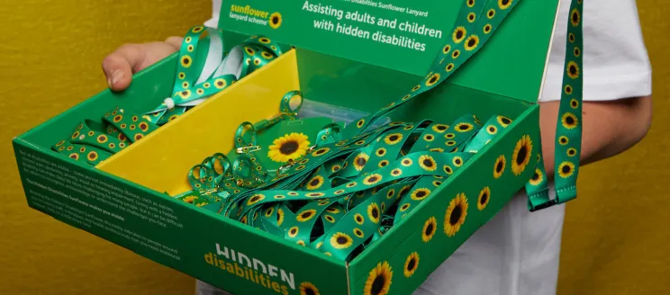 Box filled with green Sunflower Program lanyards