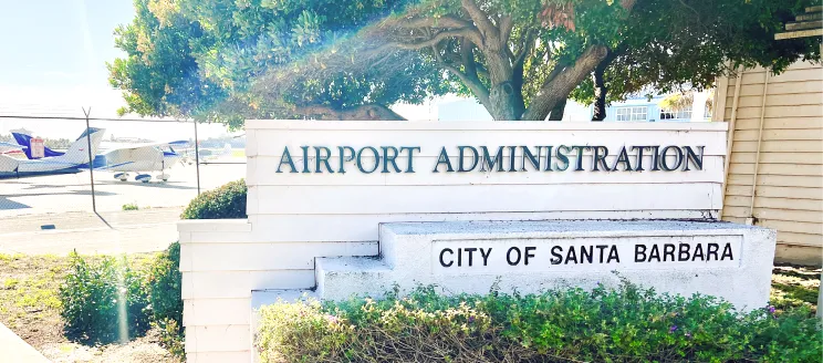 Sign reads Airport Administration, City of Santa Barbara with planes in the background