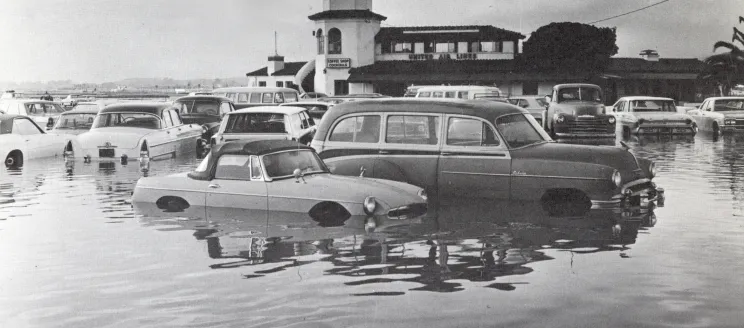 Cars parked at airport terminal in water