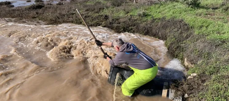 Maintenance working clearing Outfall 10 clogging