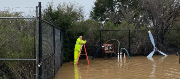 Maintenance worker working in flooded area