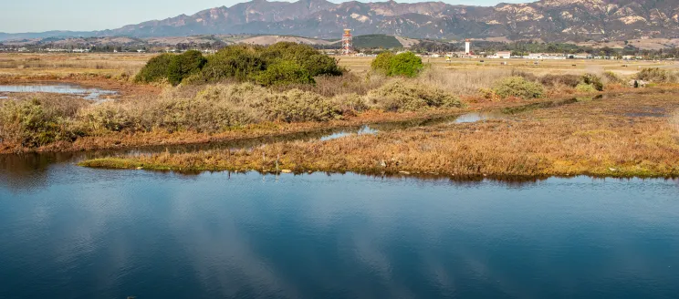 The goleta slough filled with water and the airport in the background