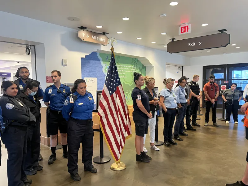 Airport and TSA staff gather for a moment of silence in the SBA Terminal